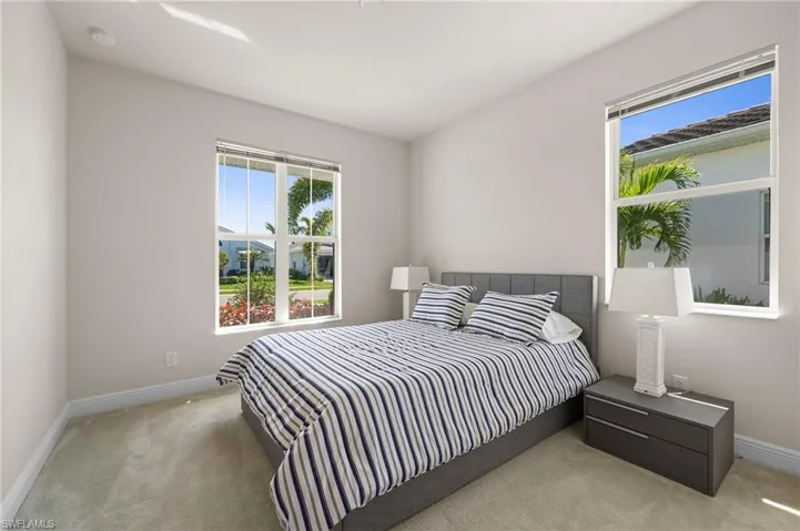 Carpeted bedroom featuring baseboards