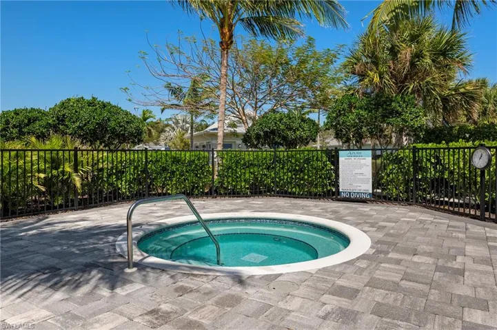 View of pool featuring a community hot tub