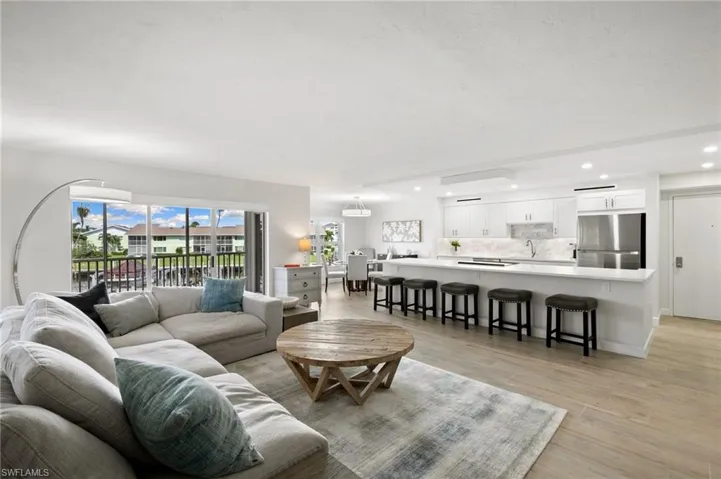 Living room featuring light hardwood / wood-style floors and sink