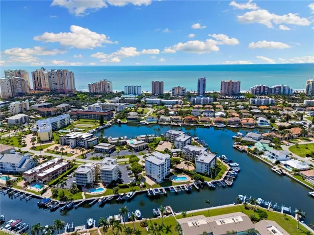 Birds eye view of property with a water view