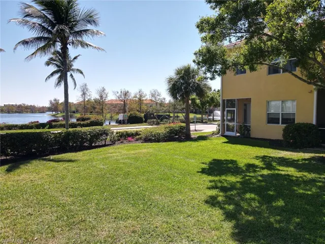 View of yard with a water view