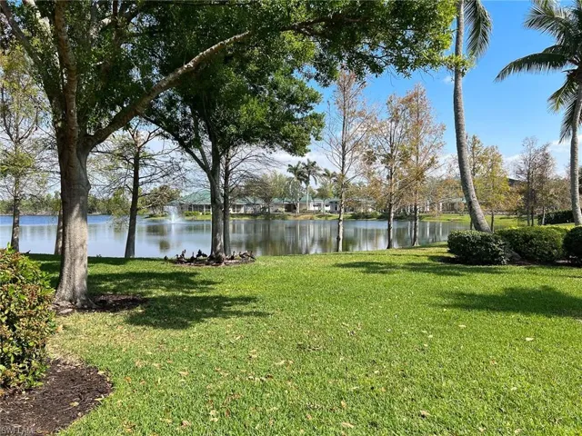 View of yard with a water view