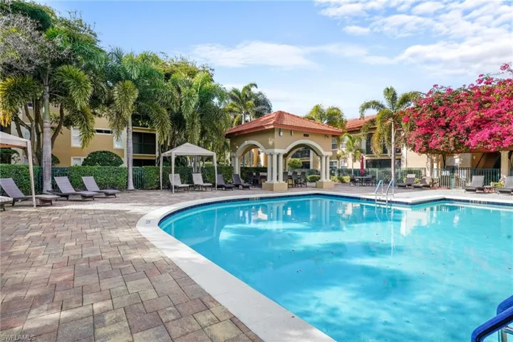 Community pool with a gazebo and a patio