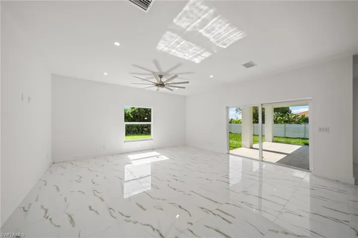 Unfurnished room with french doors and light marble finish flooring