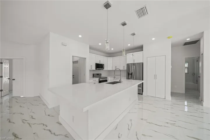 Unfurnished room with recessed lighting, light marble finish flooring, and a ceiling fan