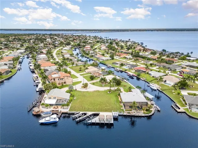 Aerial perspective of suburban area with a nearby body of water