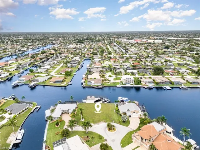 Aerial perspective of suburban area with a large body of water
