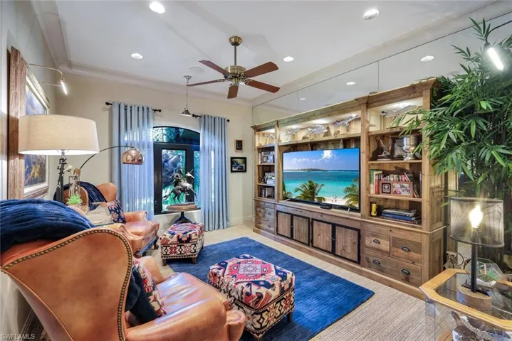 Custom built-in media console featuring extensive cabinetry and display shelving