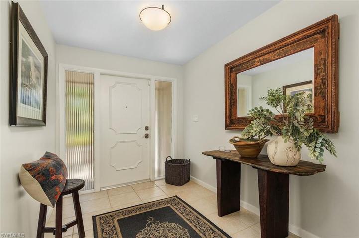 Entry hall with view of pool/water