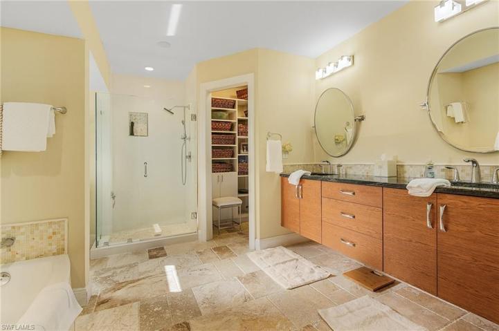 Walk in shower, separate tub, dual sinks and walkin closet