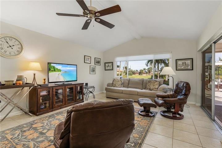 Family room with sliders to lanai and water view