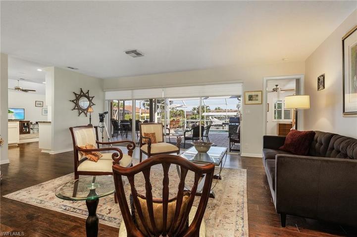 Living room flows to lanai and kitchen