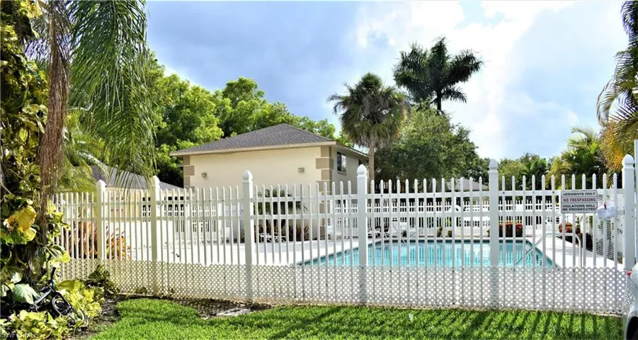 View of swimming pool with fence and a fenced in pool