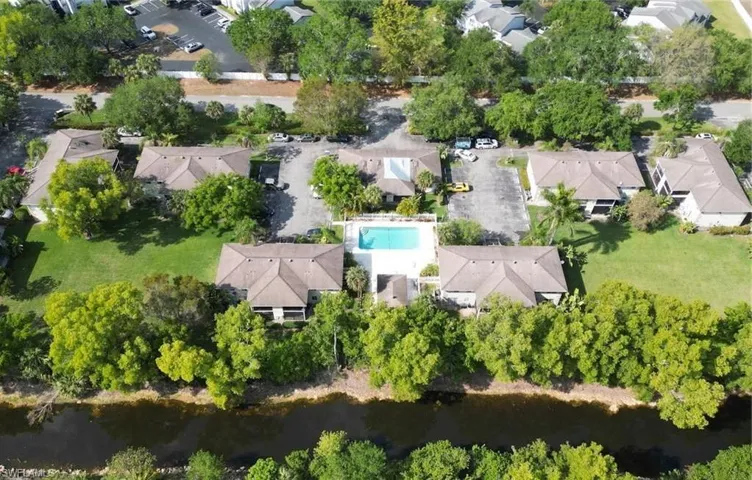 Drone / aerial view featuring a water view and a residential view