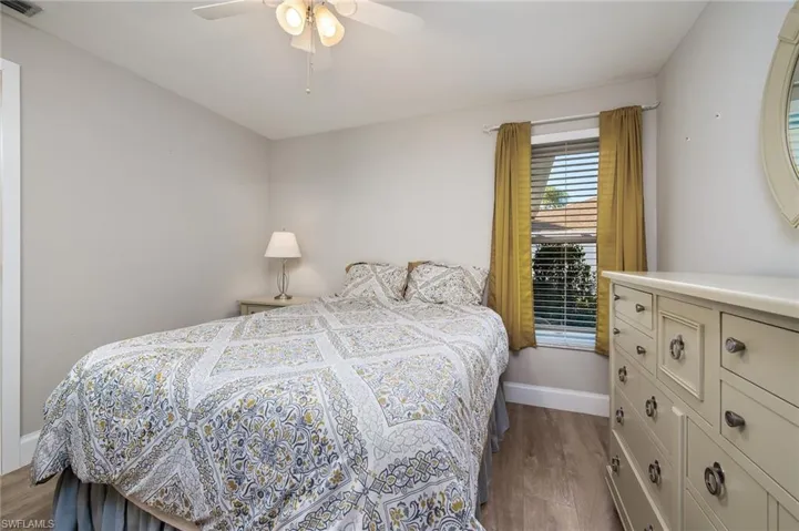 Guest Bedroom featuring a closet & ceiling fan.