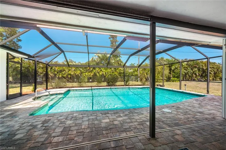 Screened in pool with beautiful backyard view!