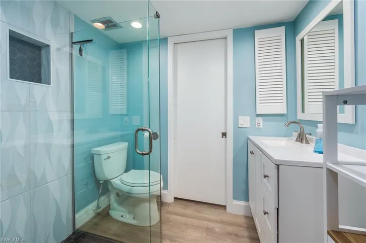 Full bath with pocket door to the office/guest bedroom with access to the hallway.