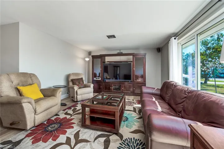 Living room featuring LVP flooring and lots of light!