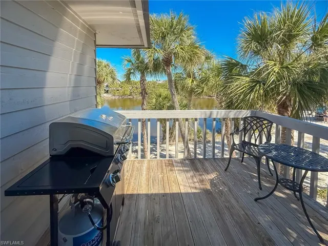 Deck featuring a water view and area for grilling