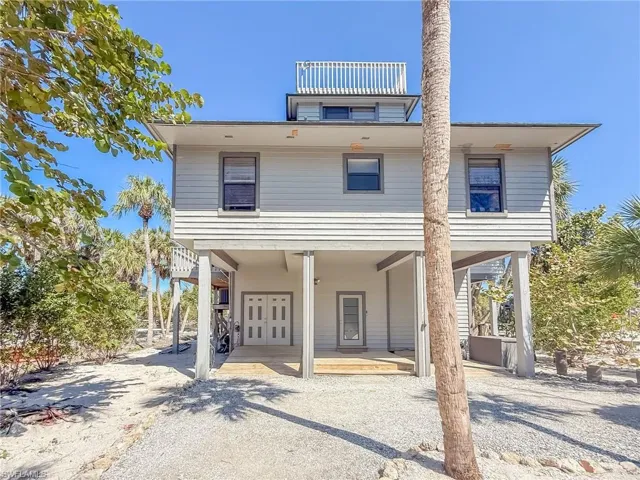 View of front of house with a carport