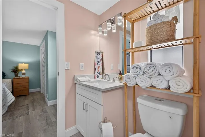 Bathroom featuring vanity and light wood finished floors