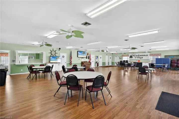 Dining room featuring light wood-type flooring and a ceiling fan