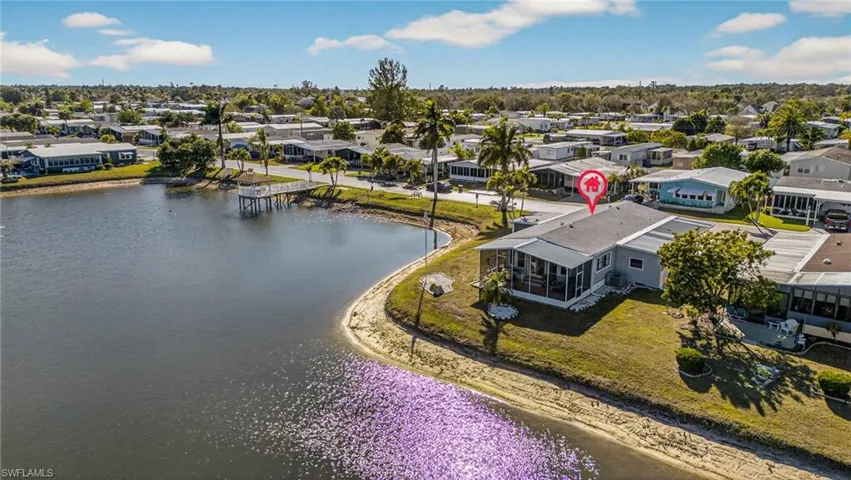 Aerial perspective of suburban area with a large body of water
