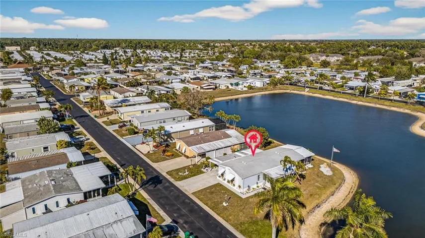 Aerial perspective of suburban area with a large body of water