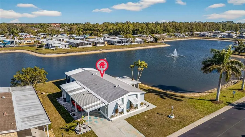 Aerial view of residential area featuring a large body of water