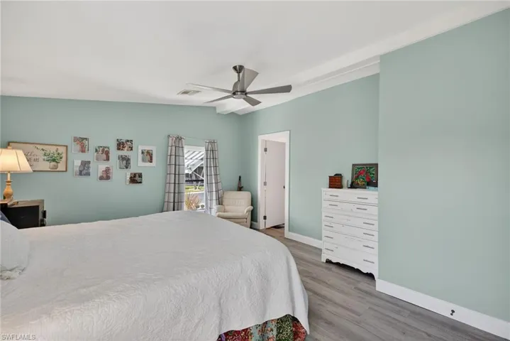 Bedroom featuring a ceiling fan and light wood-style floors