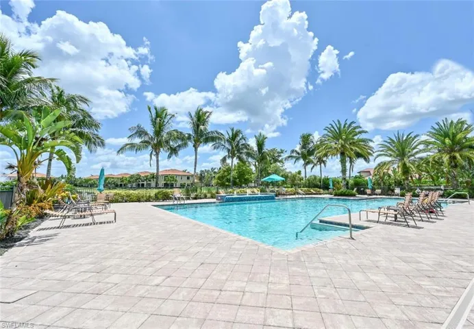 Community pool with a patio area