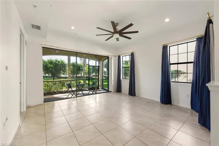 Unfurnished living area with ceiling fan, light tile patterned floors, and recessed lighting