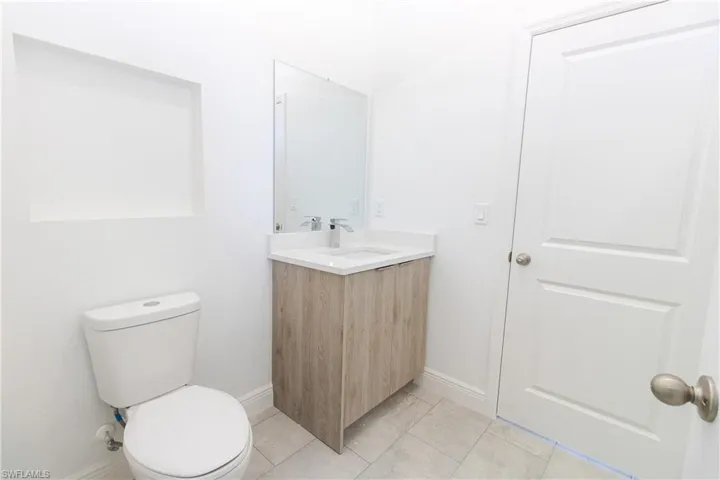 Bathroom featuring vanity and light tile patterned flooring