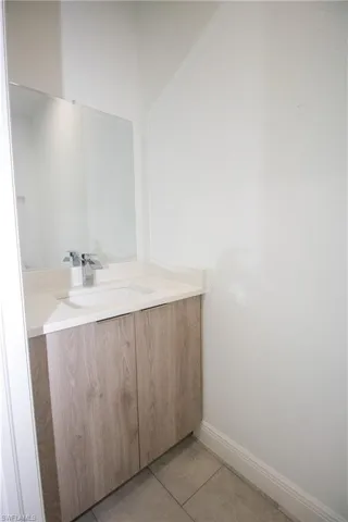 Bathroom featuring vanity and light tile patterned floors