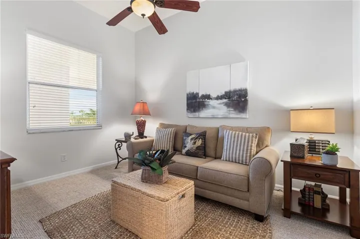 The versatile office/den features a fold-out couch, easily transforming into a third bedroom, with French doors ensuring privacy when needed.