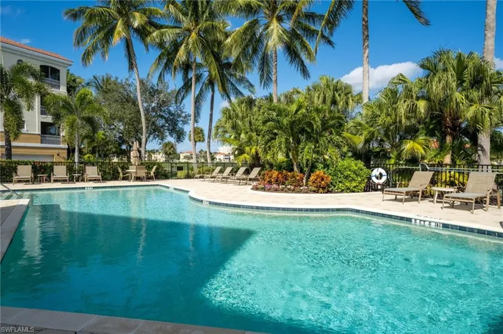 Spend your days lounging by the community pool just one building away