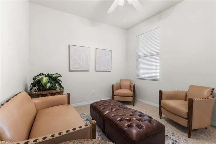 The second bedroom, elegantly arranged as a sitting room, provides versatile space to adapt to your personal needs.
