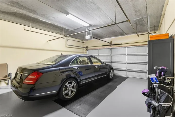 An underbuilding enclosed oversized 2-car garage provides secure parking and additional storage.