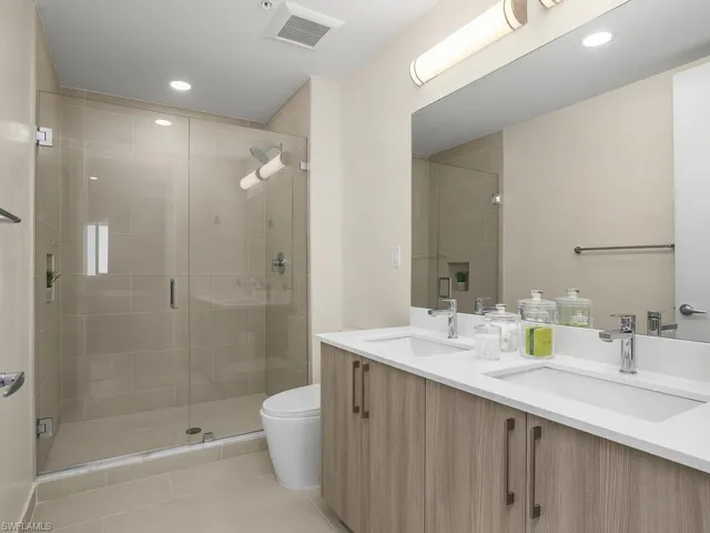 Primary Bathroom includes dual sinks and a beautiful walk-in shower