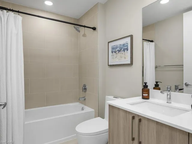 Guest bathroom offers a shower/tub combination