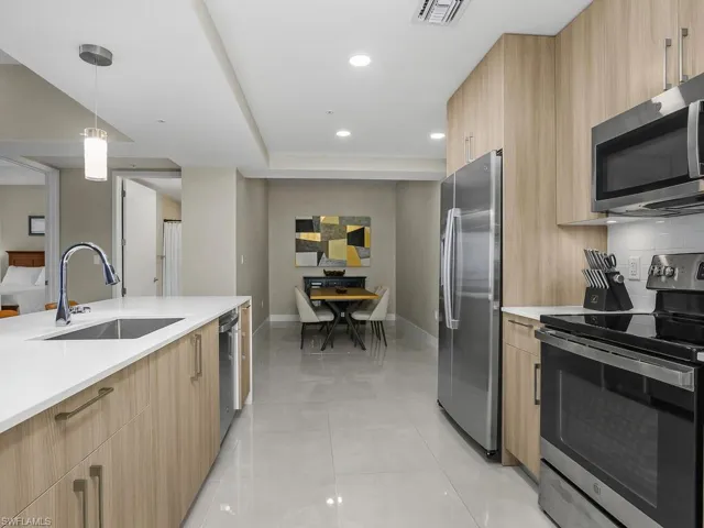 Views of the Den and Kitchen.  Den is currently being utilized as a dining room area