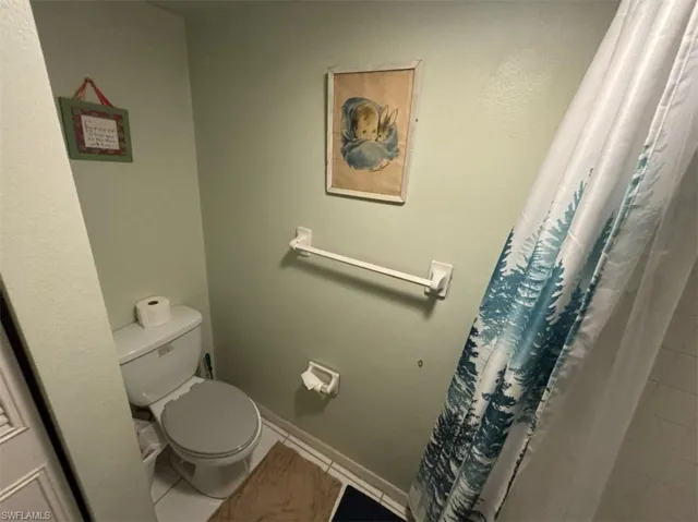 Bathroom with tile floors and toilet
