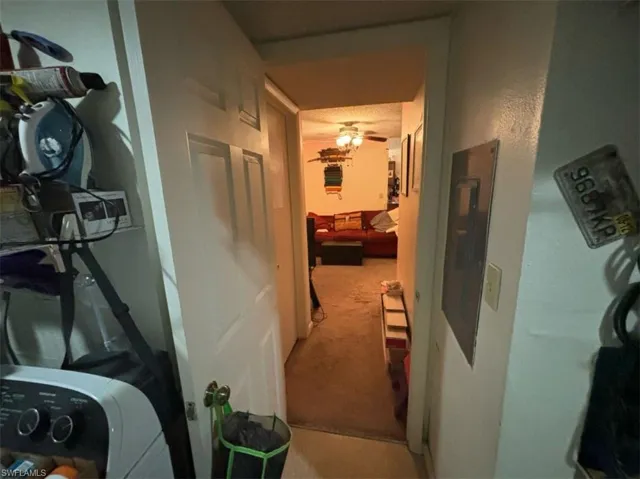 Hall featuring carpet floors