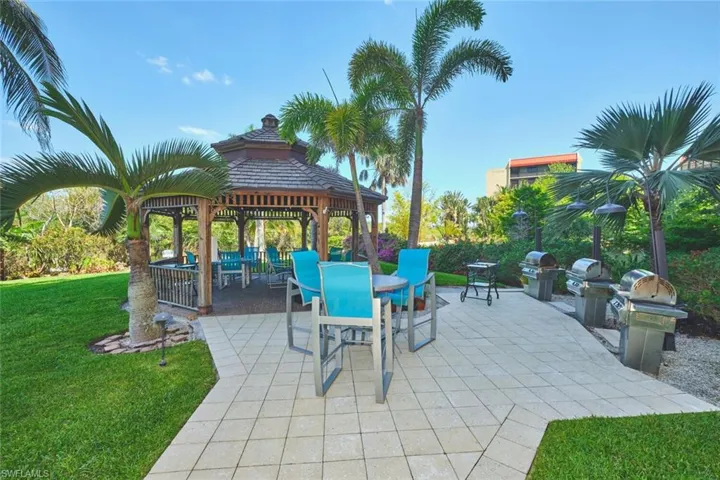 View of patio featuring a gazebo, outdoor dining area, and grilling area