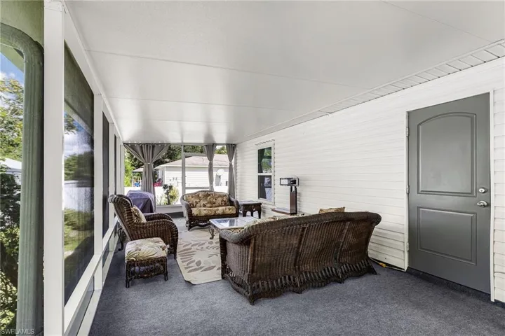 Sunroom featuring an outdoor living space