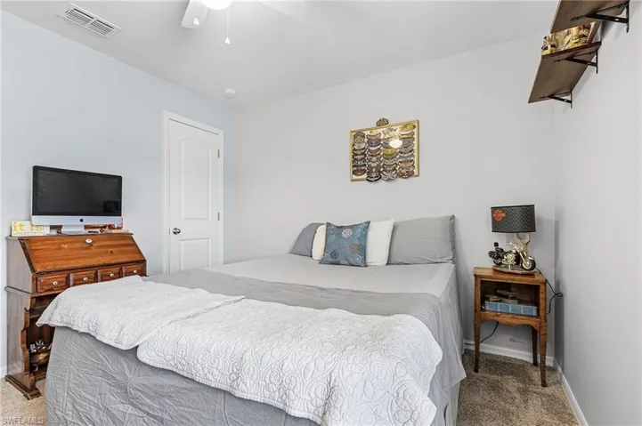 Bedroom with carpet and a ceiling fan
