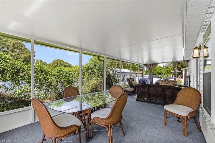 Sunroom / solarium featuring an outdoor living space and outdoor dining space