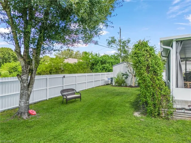 View of fenced backyard