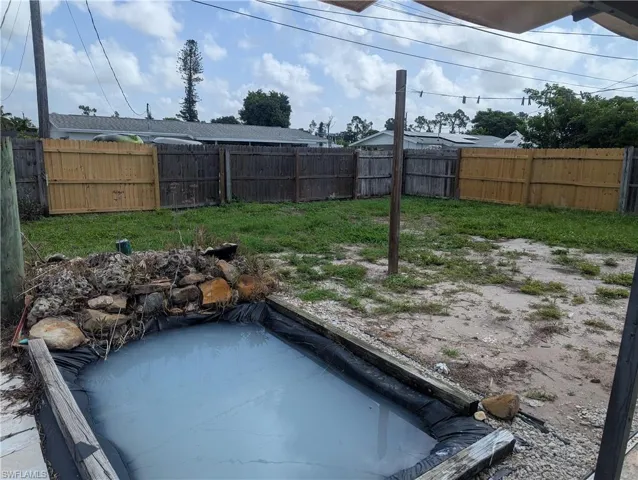 View of fenced backyard