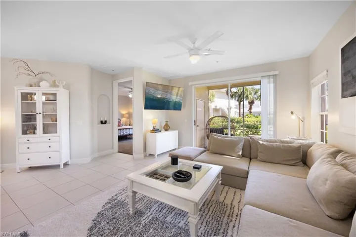 Tiled living room with ceiling fan